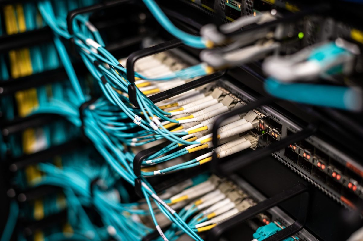 Fiber optic cables connected to a data center patch panel